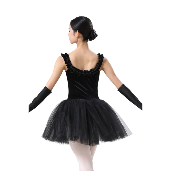 Ballerina in a black ballet outfit with a tutu on a white background