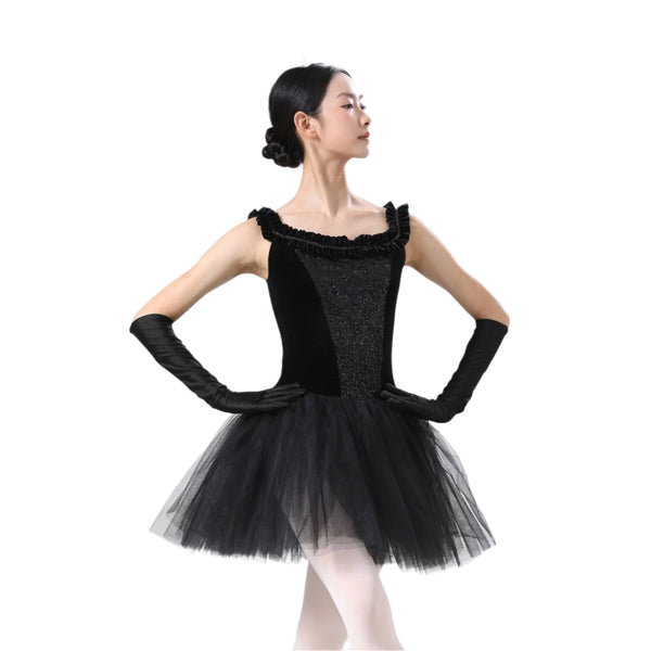 Dancer in a black tutu and gloves on a white background