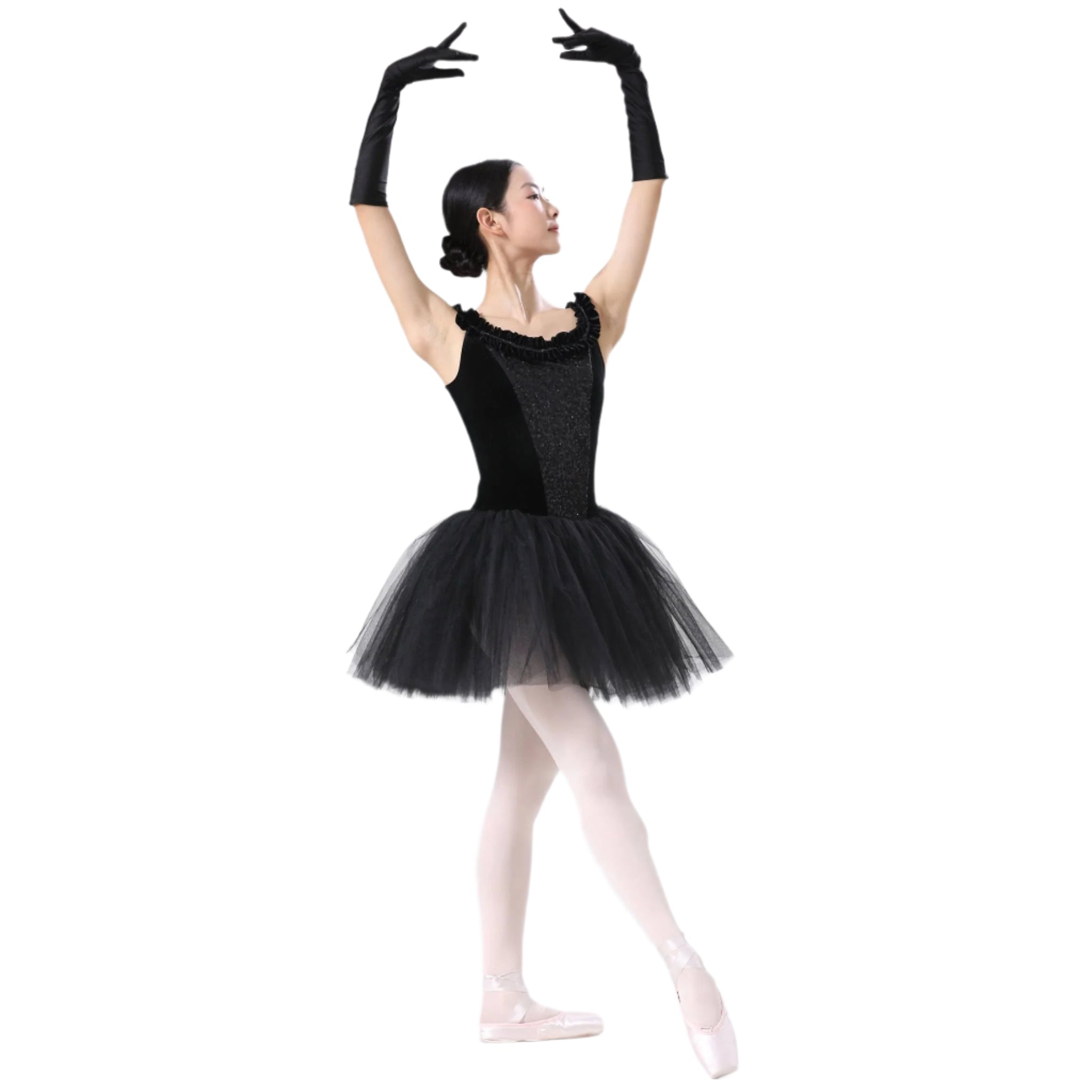 Ballerina in a black tutu and gloves posing against a white background