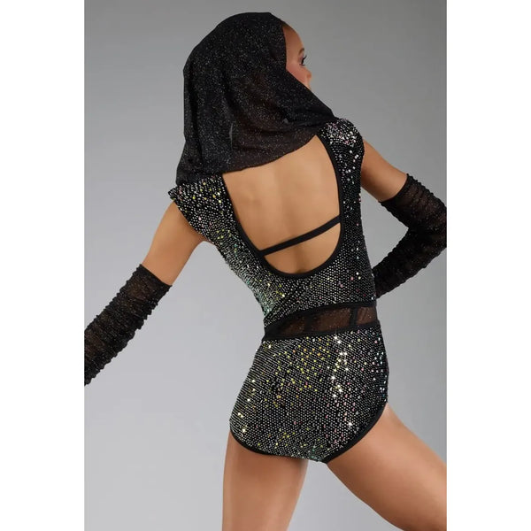 A model shown from the back wearing a black sequined and rhinestone leotard with long black mesh arm sleeves and a matching black head covering, set against a solid gray studio background.