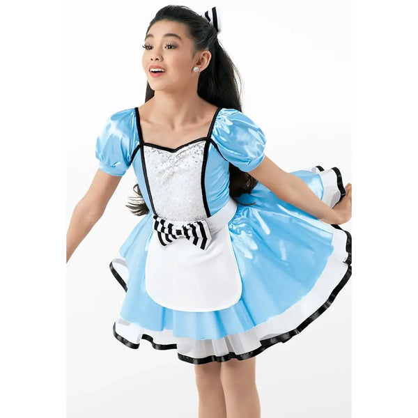 Child wearing a blue and white dress with puffed sleeves on a white background