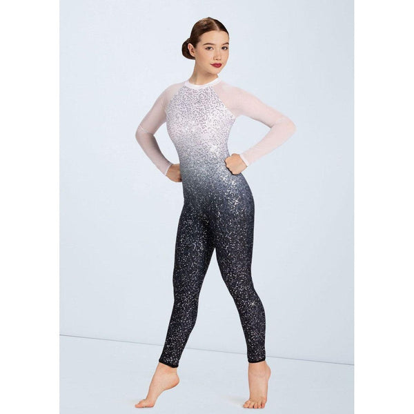 A person wearing a 'Crystallize' Sequin Catsuit with long sleeves and a round neckline, featuring ombré print sequins with a power mesh shoulder and G-hook closure at the back cutout.