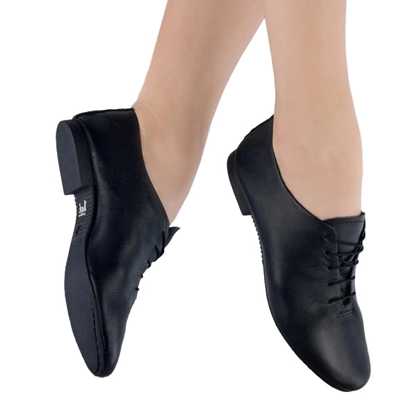 Black leather jazz shoes with full rubber sole and lace-up closure for grip and flexibility