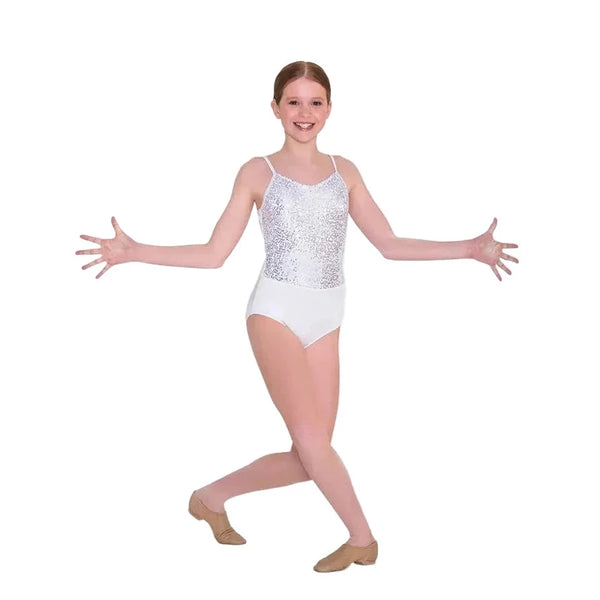 Young dancer in a white sequin front leotard posing with arms outstretched on a white background.